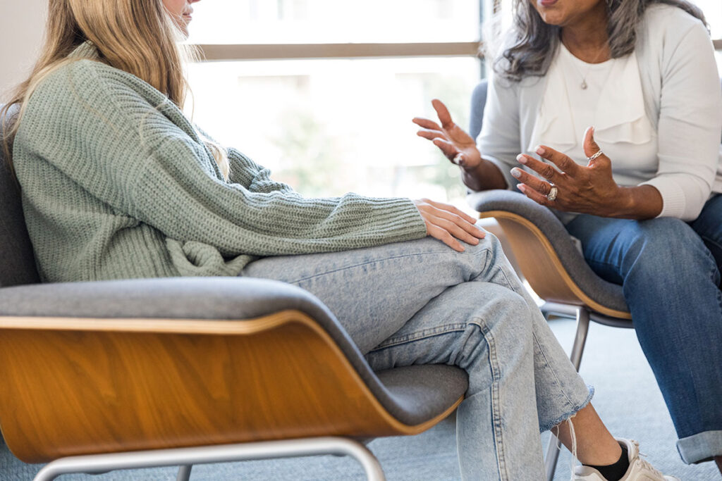 Female therapist in session with unrecognizable patient